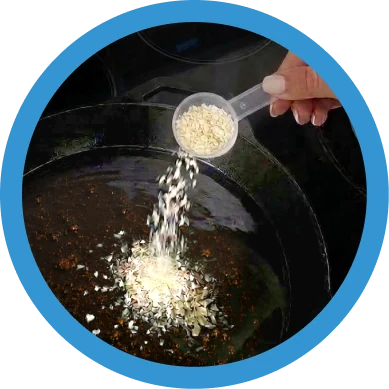 Sprinkling FryAway into hot cooking oil