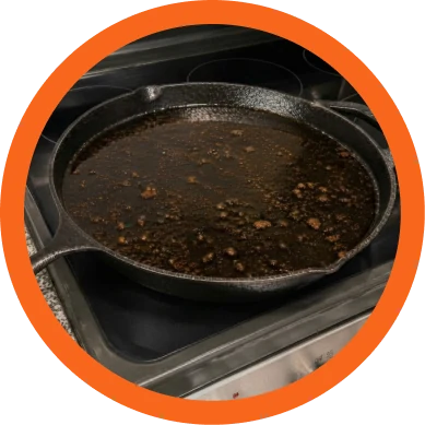Used cooking oil in a cast iron pan