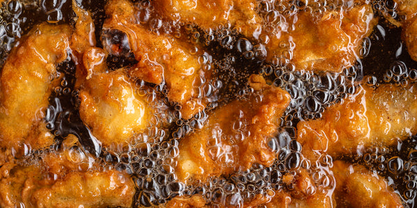 Golden chicken frying in oil