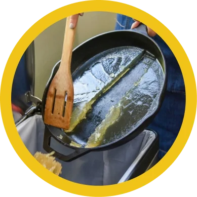 Solidified oil being lifted out of a pan
